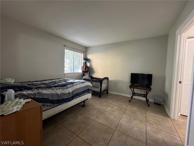 bedroom featuring tile flooring