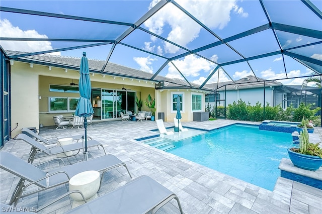 view of pool featuring a patio and glass enclosure