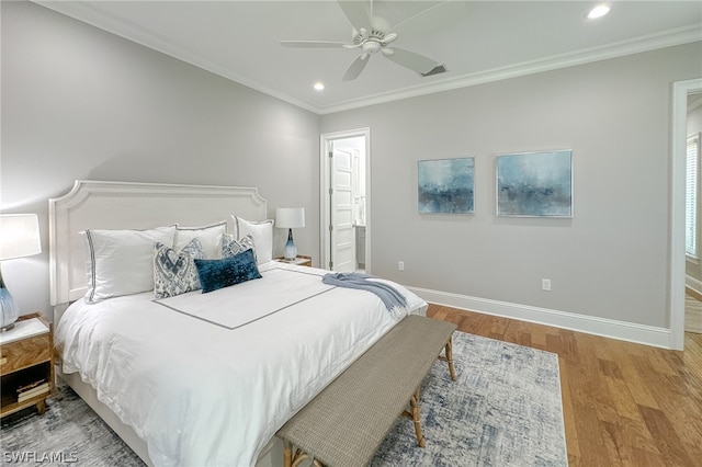 bedroom featuring ornamental molding, wood-type flooring, ceiling fan, and ensuite bathroom