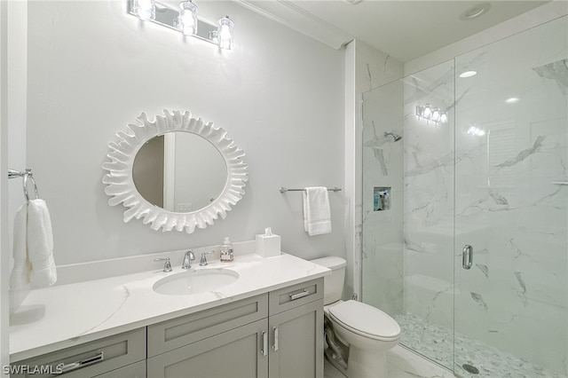 bathroom with ornamental molding, a shower with door, toilet, and vanity