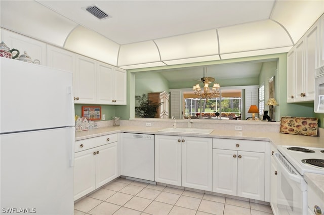 kitchen featuring white cabinetry, white appliances, and light tile floors