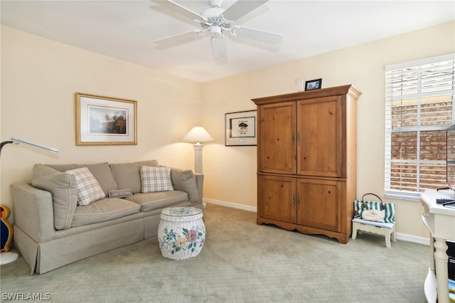 carpeted living room featuring a healthy amount of sunlight and ceiling fan