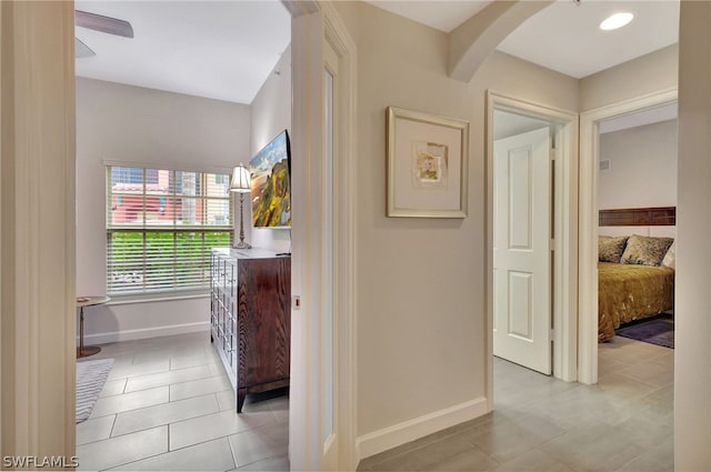 hall featuring tile flooring