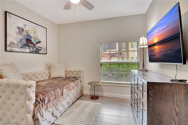 bedroom featuring ceiling fan and light tile flooring