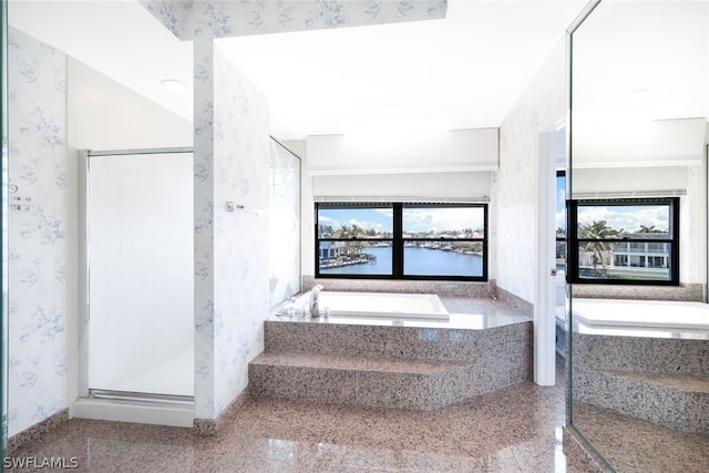 bathroom featuring tile patterned floors and separate shower and tub