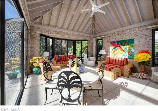 sunroom featuring wooden ceiling, ceiling fan, and vaulted ceiling with beams