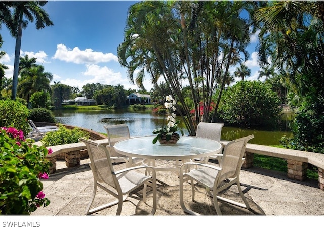 view of patio with a water view