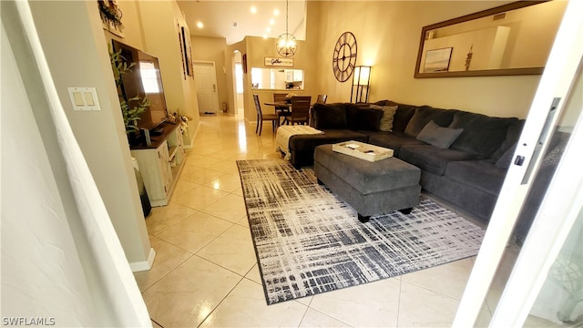 tiled living room with a chandelier