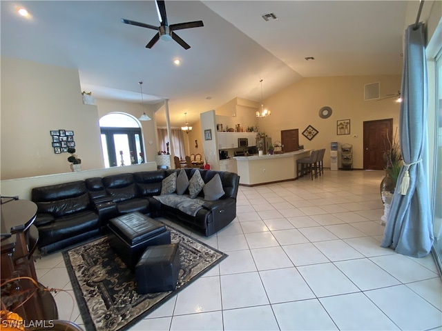 tiled living room with high vaulted ceiling and ceiling fan