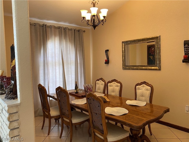 tiled dining area with a notable chandelier