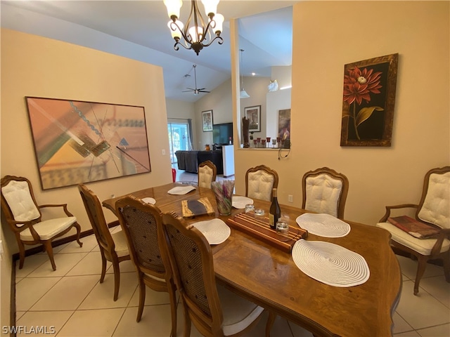 dining room featuring a chandelier, vaulted ceiling, and light tile flooring