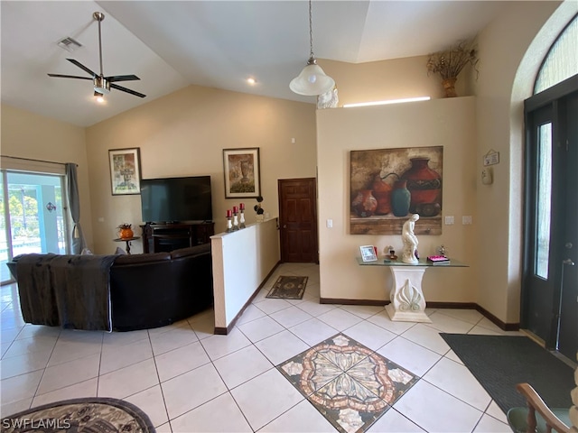 tiled living room featuring vaulted ceiling and ceiling fan