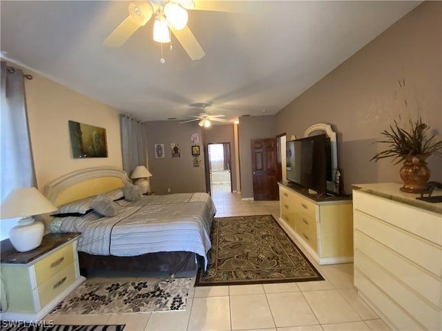 bedroom with ceiling fan and light tile flooring