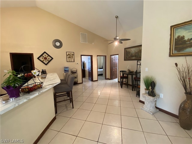 interior space with high vaulted ceiling and ceiling fan