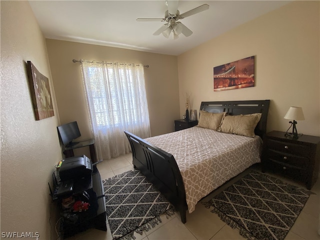 bedroom with ceiling fan and tile floors