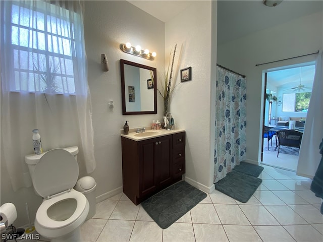 bathroom featuring toilet, tile flooring, ceiling fan, and large vanity