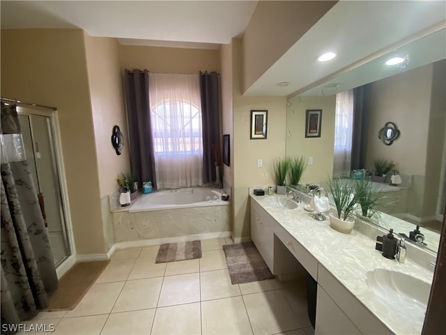 bathroom featuring tile flooring, independent shower and bath, and dual vanity