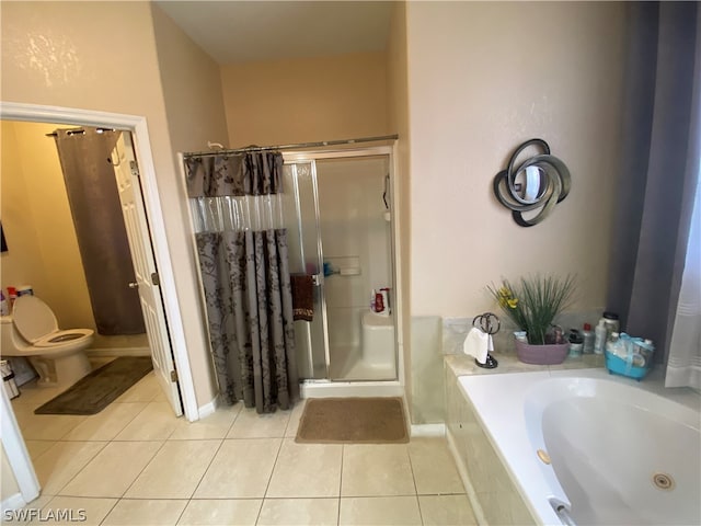 bathroom featuring shower with separate bathtub, toilet, and tile floors