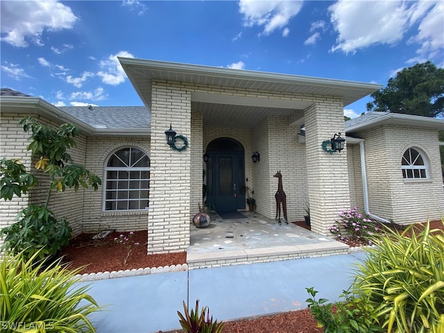 doorway to property with a patio