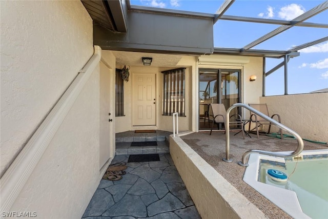 entrance to property featuring a patio area