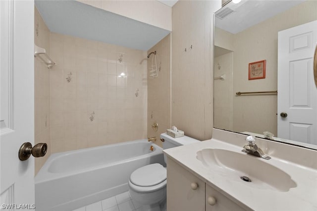 full bathroom with toilet, vanity, tile patterned floors, and tiled shower / bath