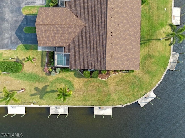 drone / aerial view with a water view