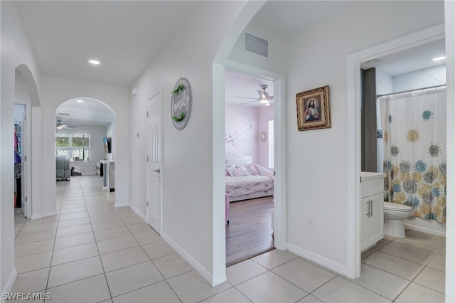 hall with light tile flooring