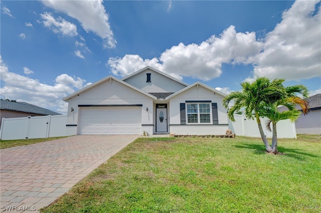 view of front of home featuring a garage and a front yard