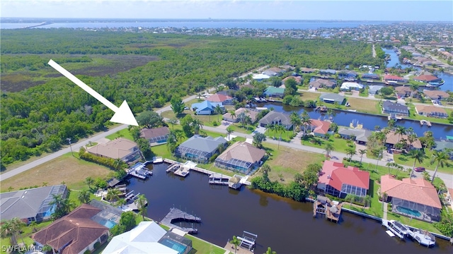 birds eye view of property featuring a water view