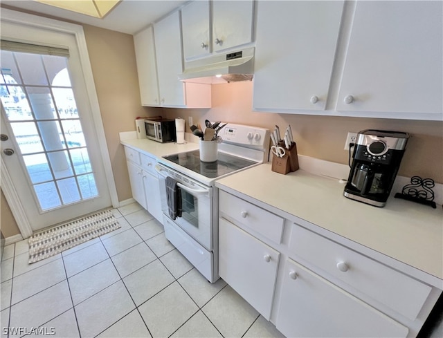 kitchen featuring white cabinetry, white range with electric cooktop, and light tile floors