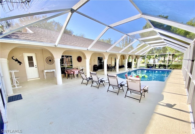 view of pool featuring a patio area and a lanai