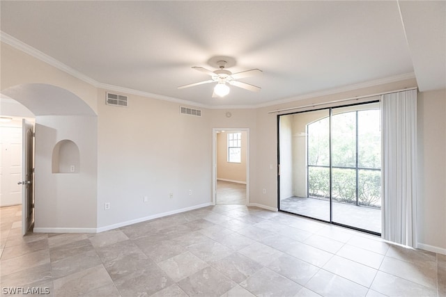 spare room with ornamental molding, ceiling fan, and light tile floors