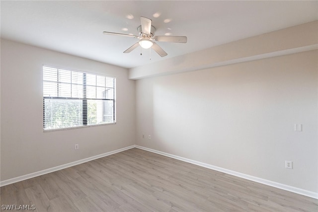 unfurnished room with light hardwood / wood-style flooring and ceiling fan