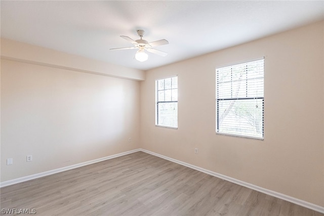 unfurnished room with light hardwood / wood-style flooring and ceiling fan