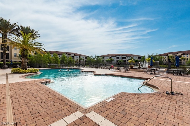 view of swimming pool with a patio area