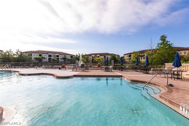 view of swimming pool with a patio