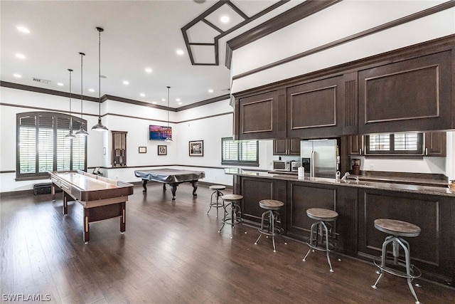 recreation room with ornamental molding, dark hardwood / wood-style flooring, and billiards