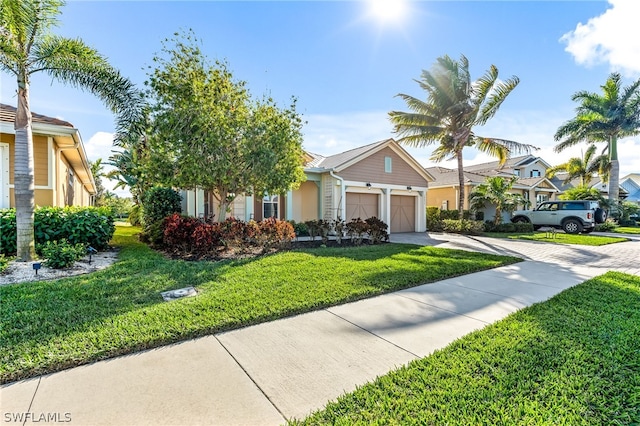 view of front facade with a front lawn and a garage