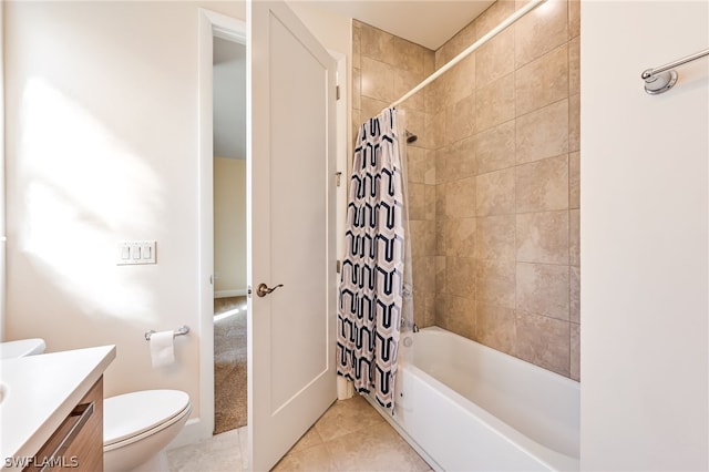 full bathroom featuring toilet, tile flooring, vanity, and shower / tub combo with curtain