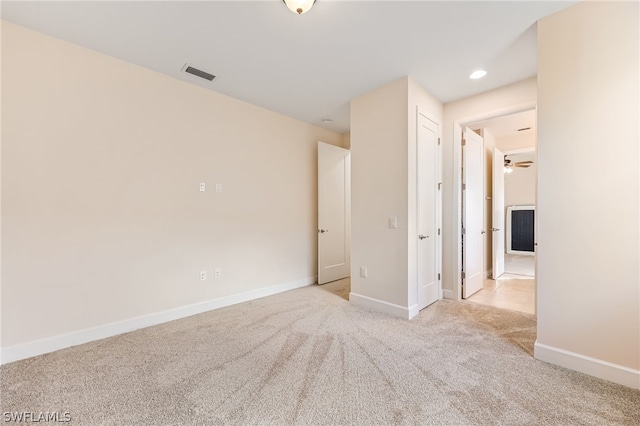 unfurnished bedroom featuring light colored carpet