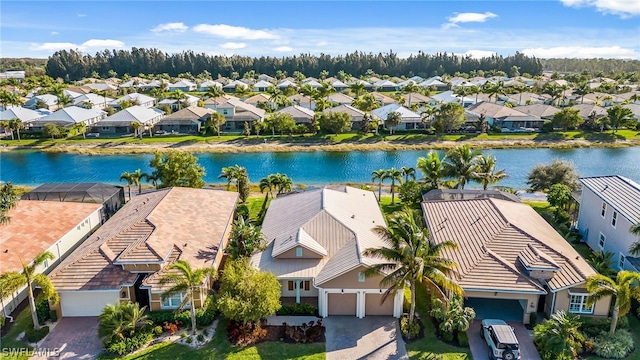 birds eye view of property with a water view