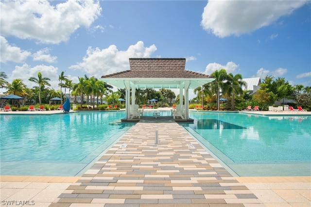 view of swimming pool with a gazebo and a patio