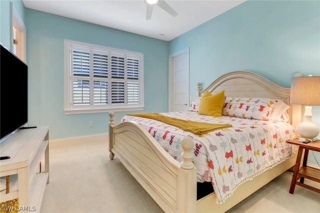 bedroom with light colored carpet and ceiling fan