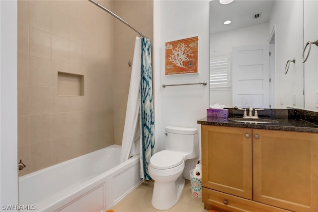 full bathroom featuring tile patterned flooring, shower / bath combo, vanity, and toilet