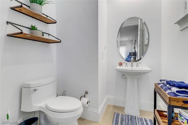 bathroom featuring toilet