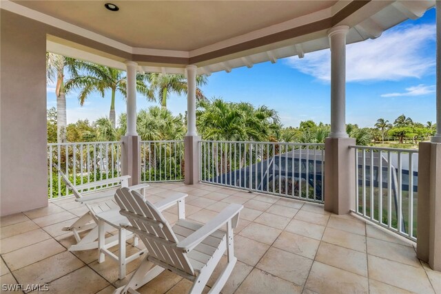 view of patio featuring a balcony