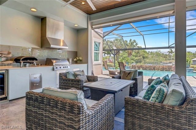 view of patio / terrace featuring an outdoor kitchen, area for grilling, and a lanai