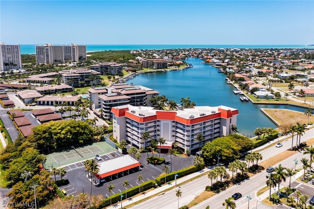 birds eye view of property featuring a water view