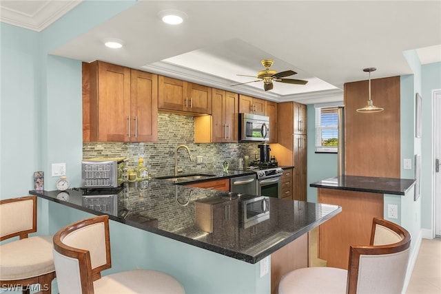 kitchen featuring kitchen peninsula, hanging light fixtures, ceiling fan, stainless steel appliances, and light tile floors