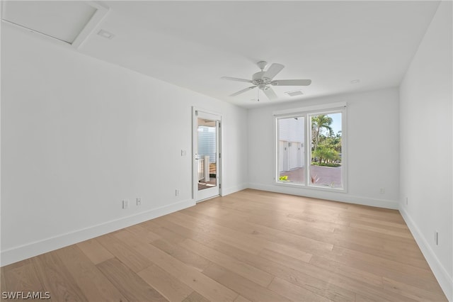 spare room with light hardwood / wood-style floors and ceiling fan